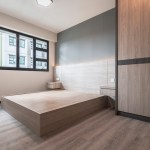 Bedroom with a platform bed frame and built-in wardrobe