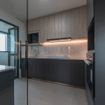 Enclosed kitchen with a glass partition and under-cabinet lighting