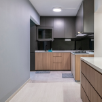 Galley kitchen with timber base cabinets and dark upper cabinets