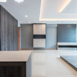 Living area with grey feature cabinetry and a cove-lit false ceiling