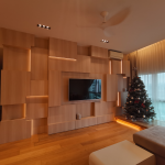 Living room with a geometric timber feature wall and TV