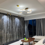 Living room with a dark marble-look feature wall and a round coffee table