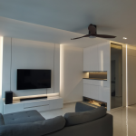 Living room with a floating TV console, ceiling fan and grey sofa