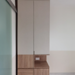 Tall white storage cabinet with a timber display niche