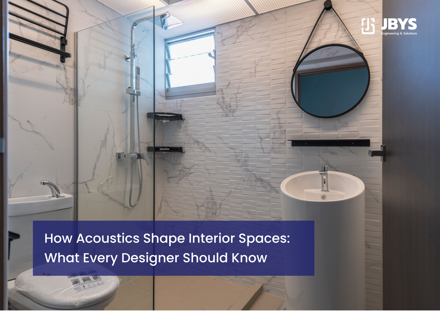 Modern tiled bathroom with a glass walk-in shower and hanging round mirror.