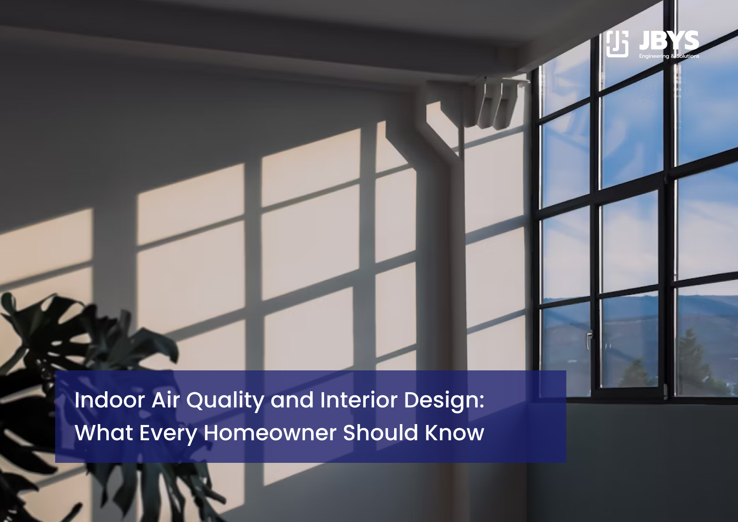 Sunlit room with large black-framed windows for natural ventilation