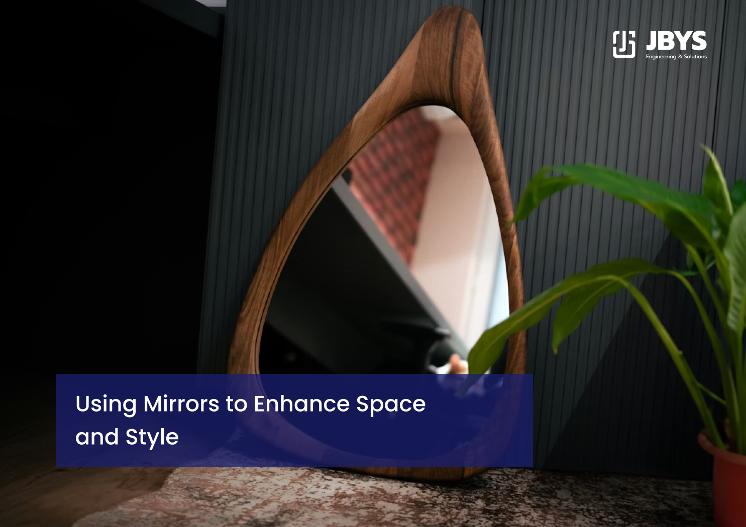 Sculptural timber-framed mirror in a dark room