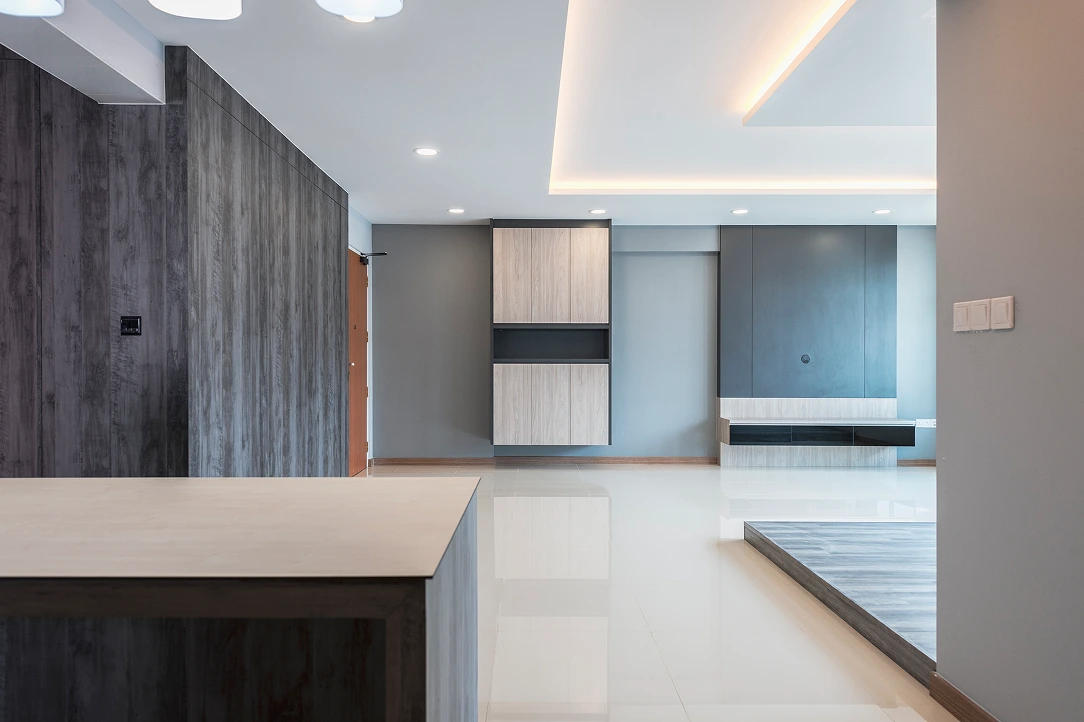 Compact fitted kitchen with timber cabinetry, black hob and integrated appliances